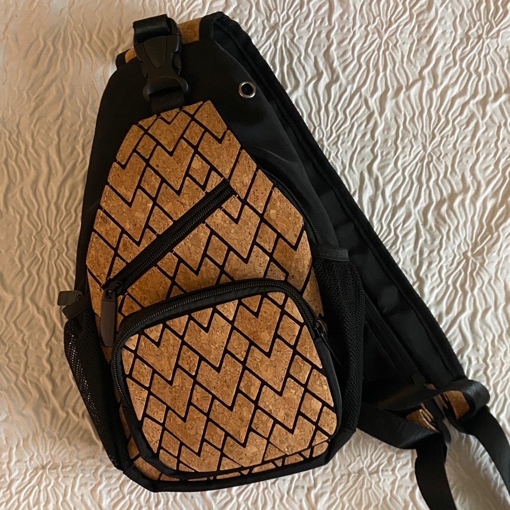 Stylish Black and Brown Sling Bag that opens to a backpack, made with cork!